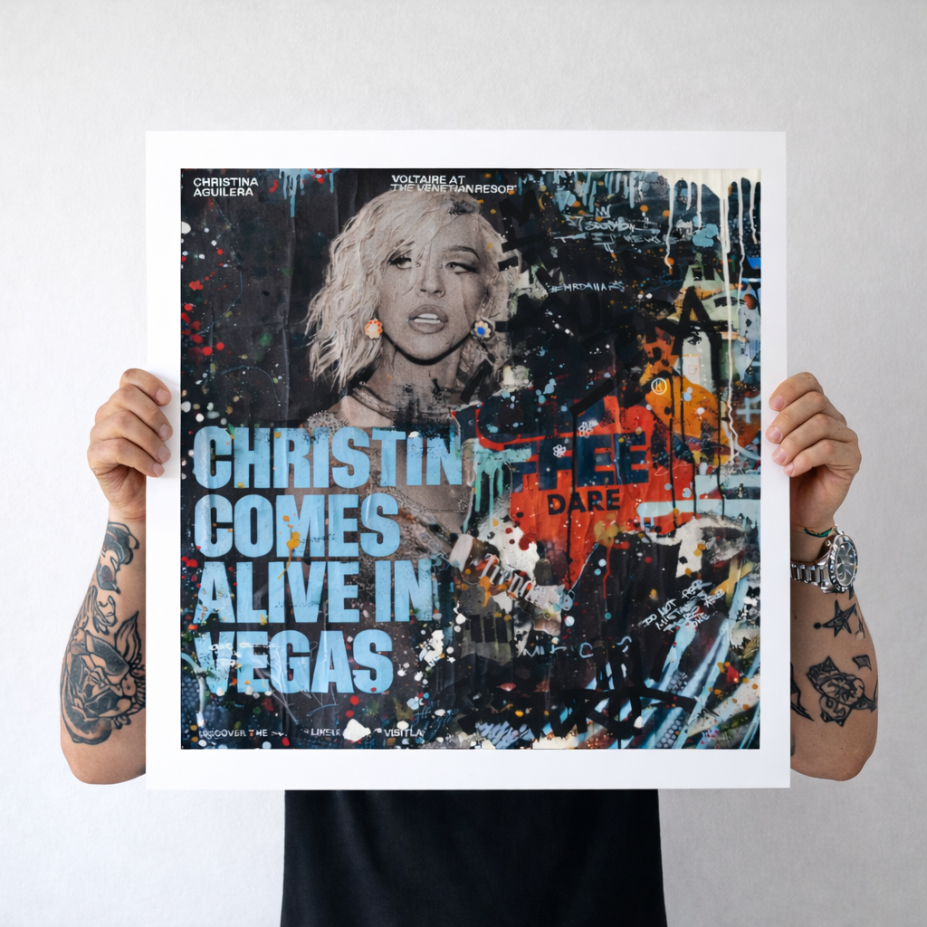 Person holding a poster with a colorful design and text about a concert in Las Vegas.