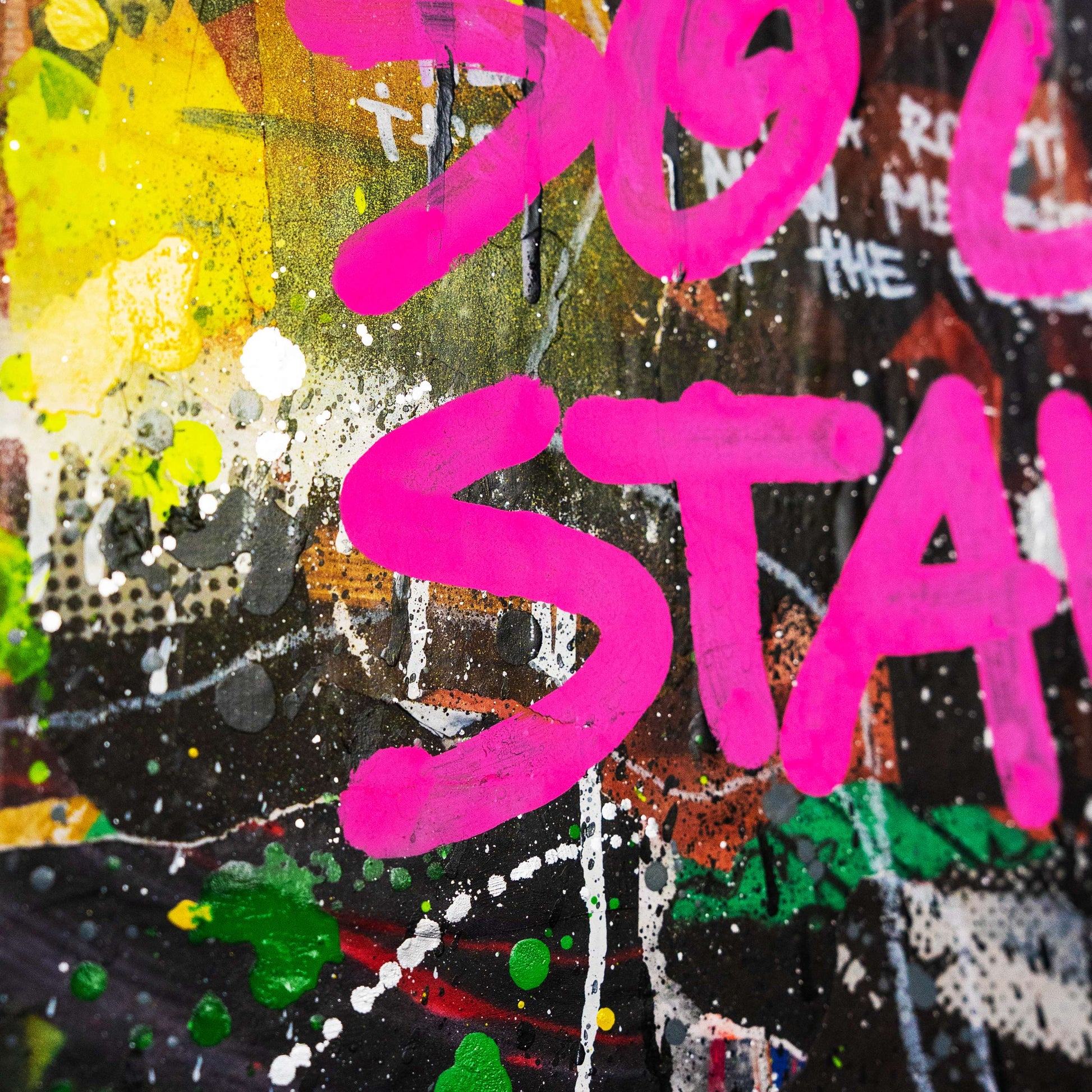 Colorful abstract art with pink text on a textured background