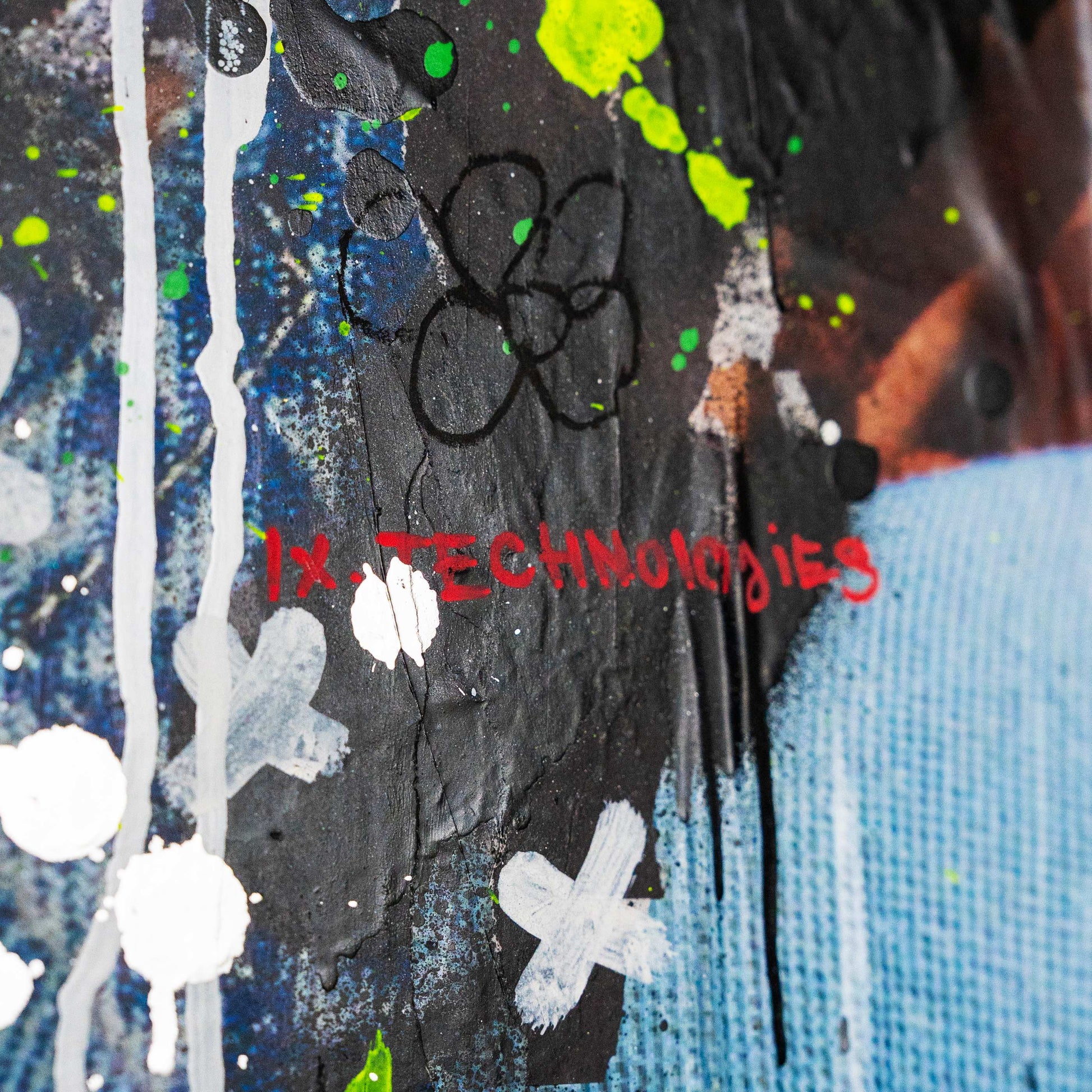 Abstract art piece with splashes of color and 'IX Technologies' text.
