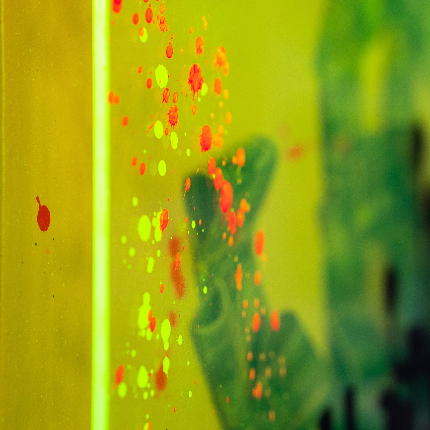 Close-up of a colorful, abstract pattern on a yellow background