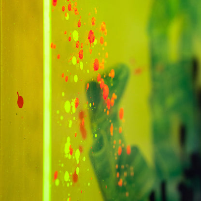 Close-up of a colorful, abstract pattern on a yellow background