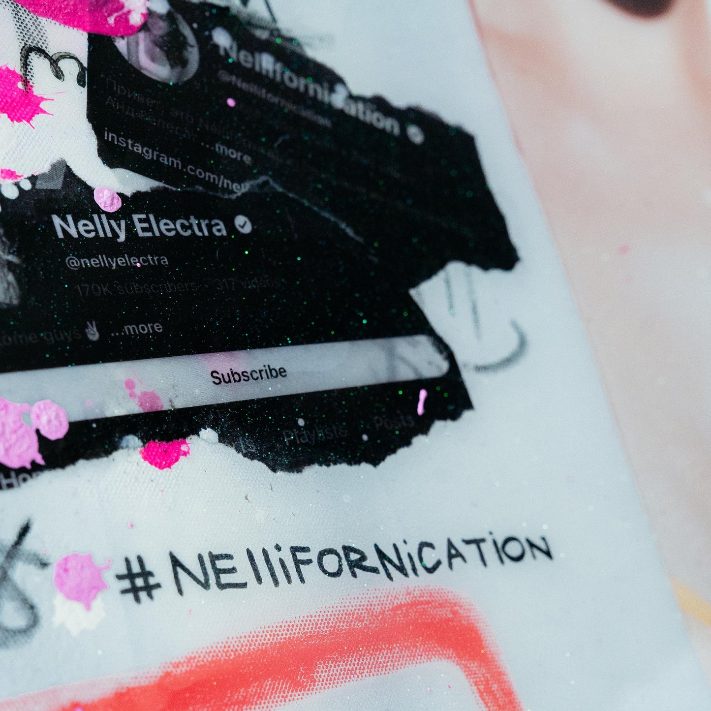 Phone case with Nelly Electra branding and '#Nelliifornication' text.