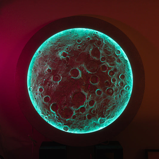 Glowing moon-like object with textured surface on a dark background