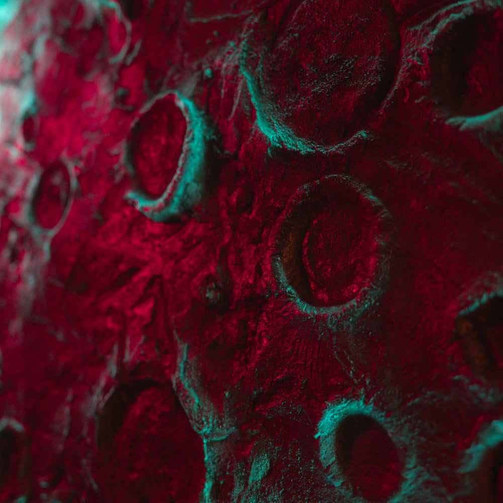Close-up of a textured red surface with circular patterns