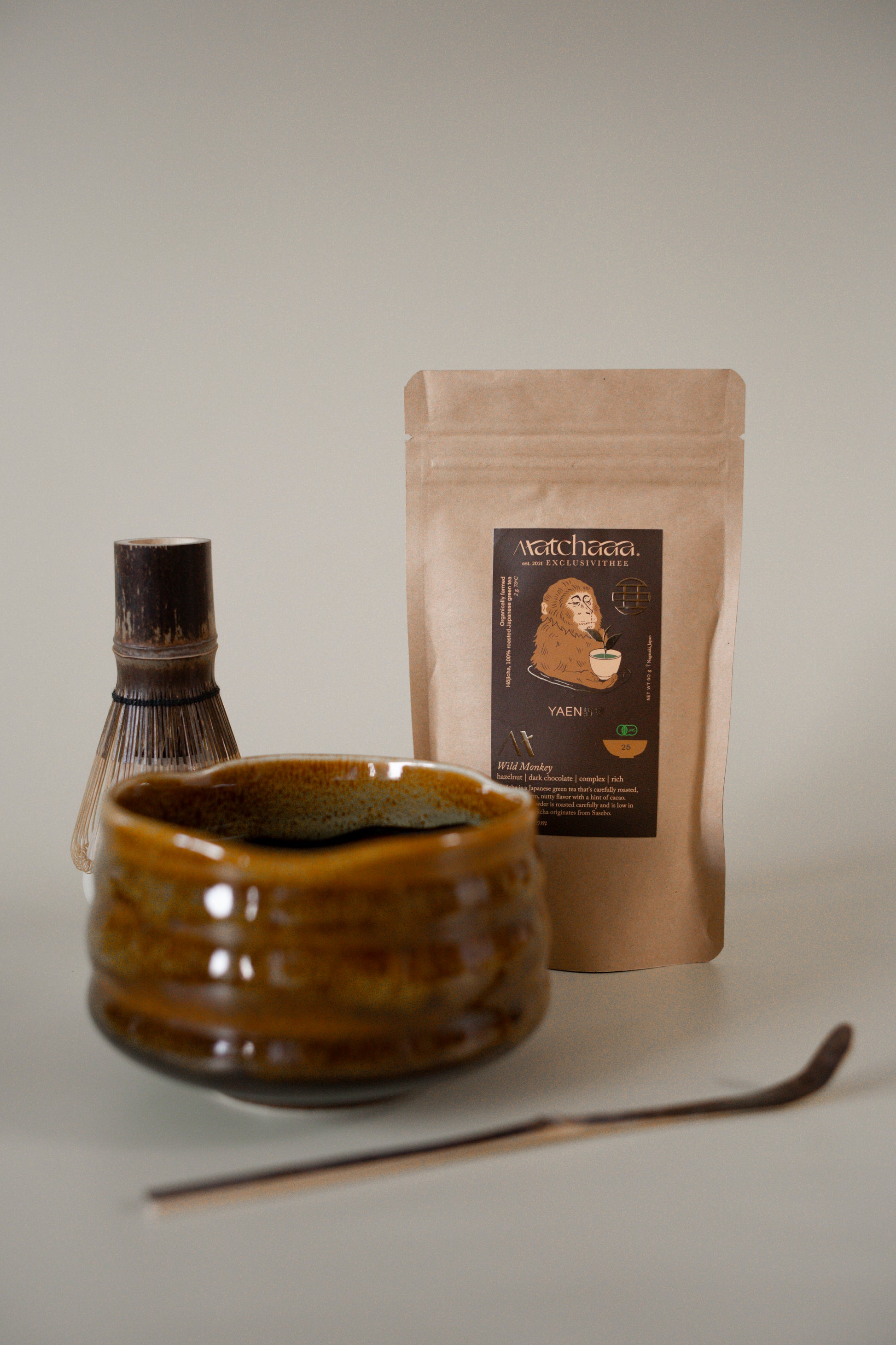 Cartoon character wearing a red hat with a pattern, holding money, on a colorful abstract background.