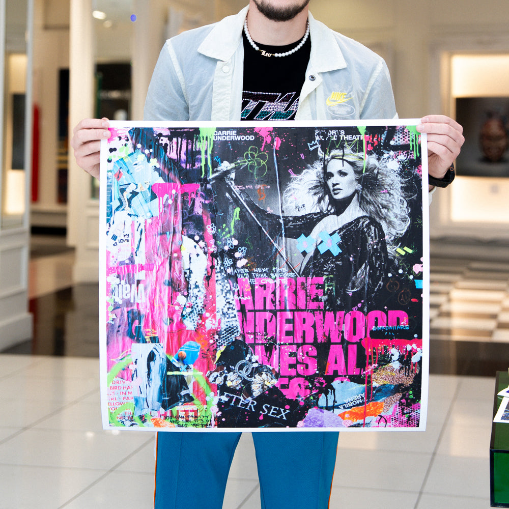Person holding a colorful poster with text and images in an indoor setting